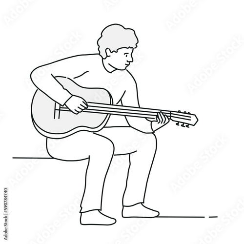 Student playing the guitar.