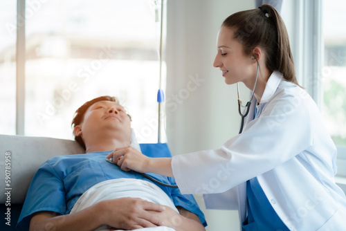 Doctor with stethoscope examining patient and checking the salt water, Health care concept.