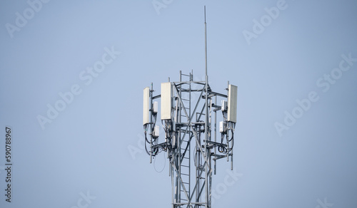 Telecommunication tower. Antenna on gray sky. Radio and satellite pole. Communication technology. Telecommunication industry. Mobile or telecom 5g network. Network connection business background.