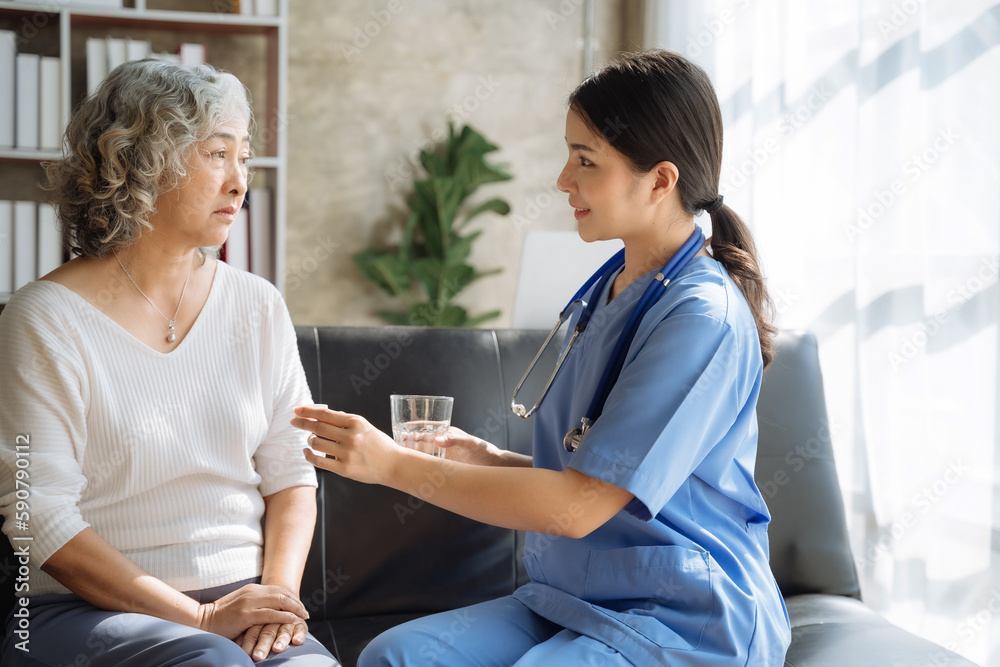 Female therapist recommending pills to elderly patients Female therapist recommending pills to elderly patients