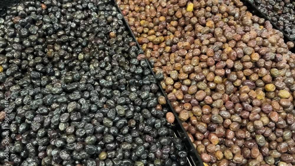 Olive varieties. Delicious olives at the deli counter Olive varieties. Delicious olives at the deli counter