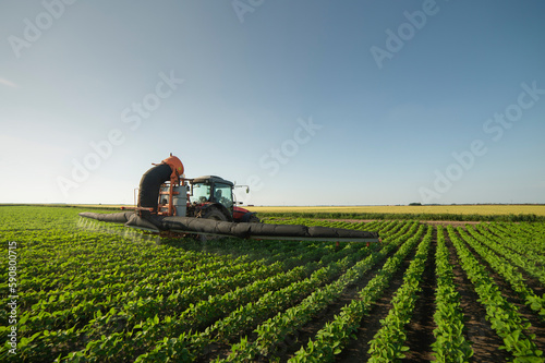 Spraying pesticides at soy bean fields