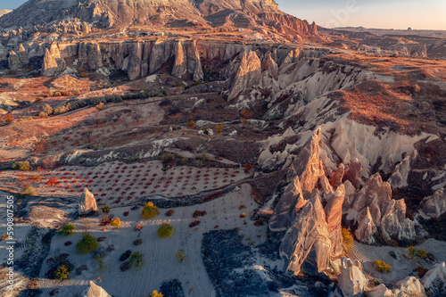 Panoramic view of Goreme national park with over deep canyons, valleys sunset Cappadocia. Popular Turkey touristic destination, aerial top view drone