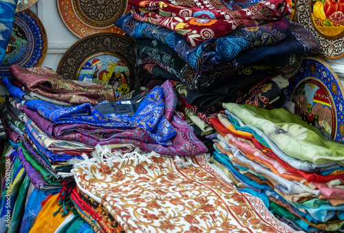 traditional souvenir shop selling colorful cloth and scarf in Uzbekistan