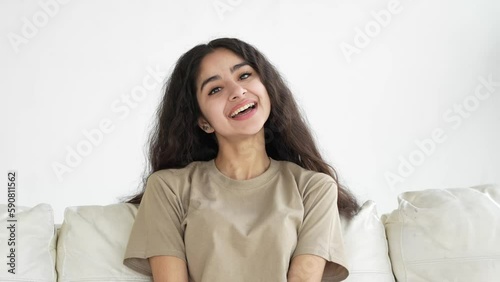 Natural beauty woman. Portrait of beautiful young Indian woman with sincere and natural joyful emotions. Close-up, natural lighting of the room. Natural beauty woman. photo