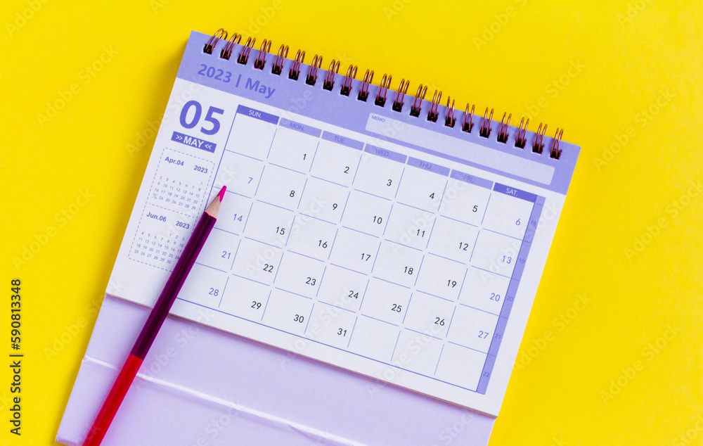 Calendar for May 2023 on a yellow background. Calendar for May 2023 on a yellow background.