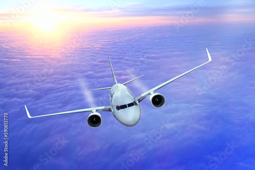 White passenger airplane flying in the sky amazing clouds in the background - Travel by air transport