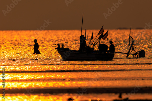 Fishing boat on sunset