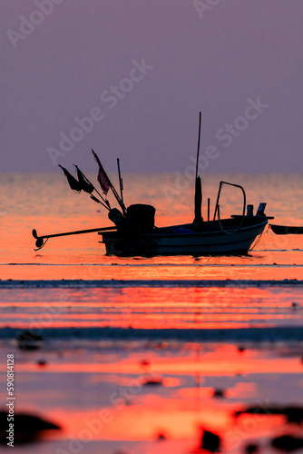 Fishing boat on sunset