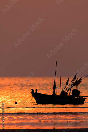 Fishing boat on sunset