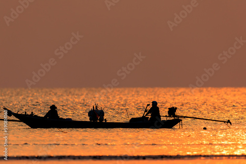 Fishing boat on sunset