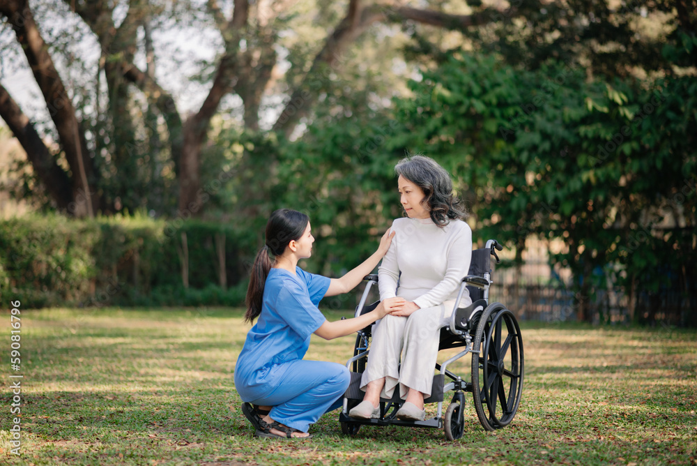 Elderly asian senior woman on wheelchair with Asian careful caregiver. Elderly asian senior woman on wheelchair with Asian careful caregiver.