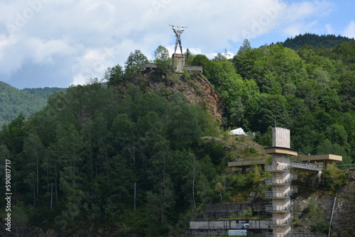 Lake Vidraru  is an artificial lake in Romania. It was created in 1965 by the construction of the Vidraru Dam on the Argeș River. Statue 'Energia', representing Prometheus with lightnings in his hand,