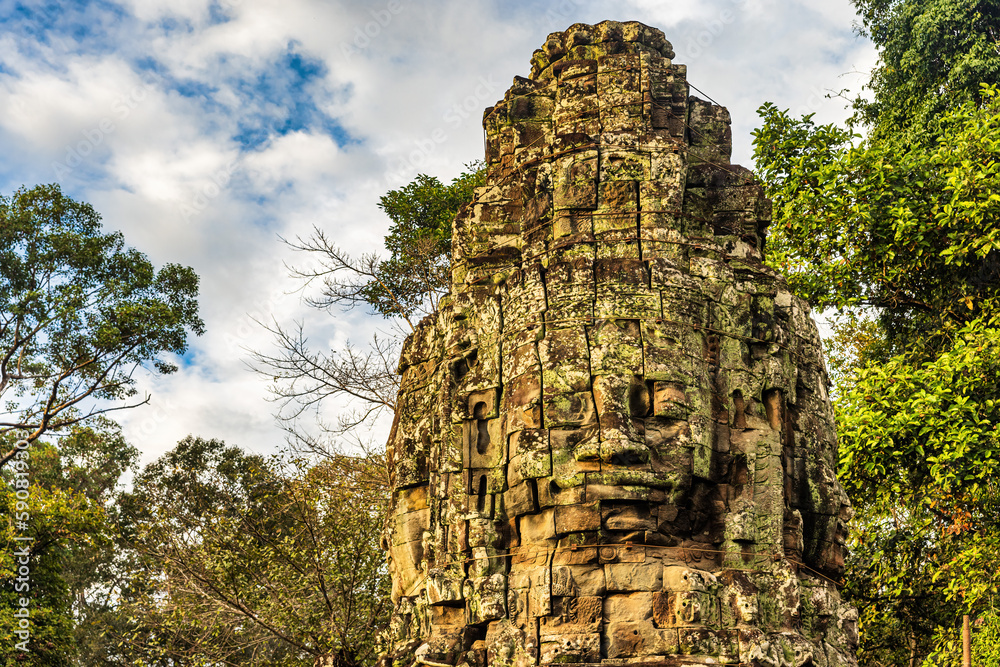 Stone face at the entrance tower to Ta Prohm temple in Angkor complex, Siem Reap, Cambodia