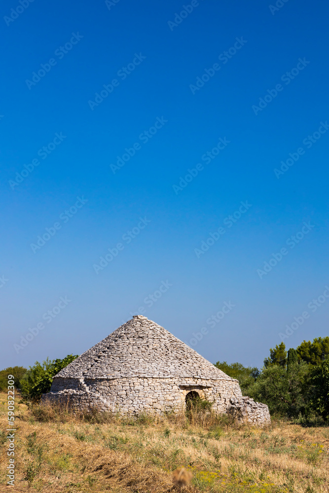 Trulli, typical houses near Castel del Monte, Apulia region, Italy Trulli, typical houses near Castel del Monte, Apulia region, Italy