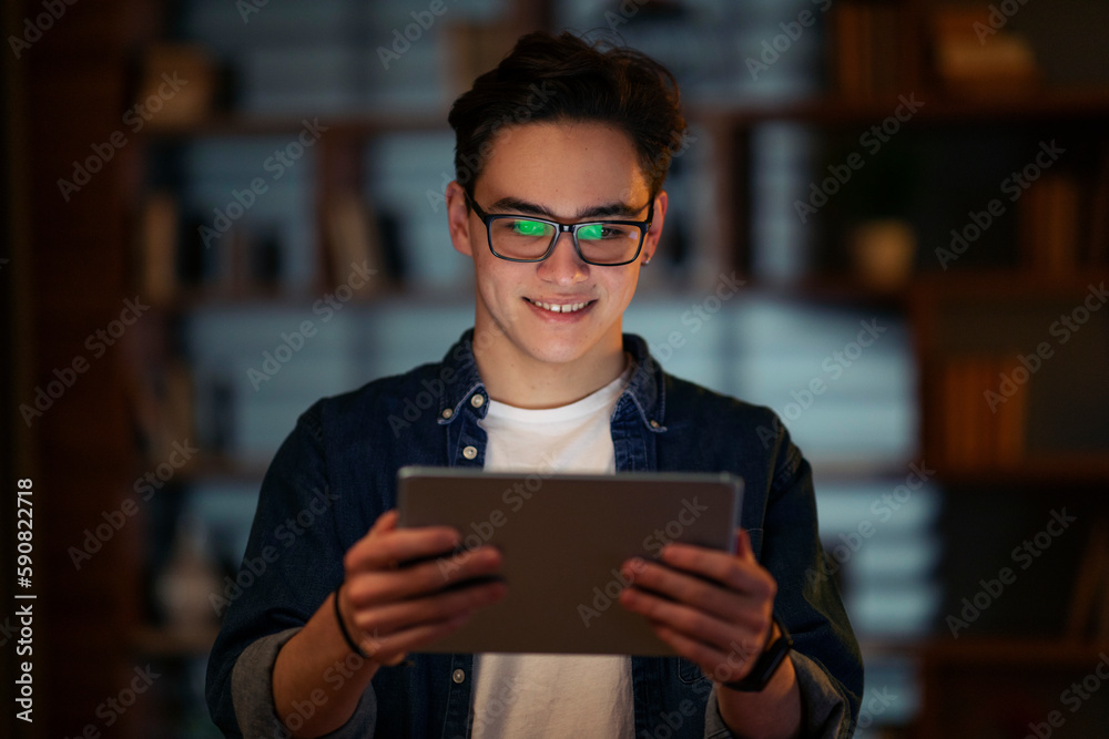 Smiling young guy holding using digital tablet pc at office Smiling young guy holding using digital tablet pc at office