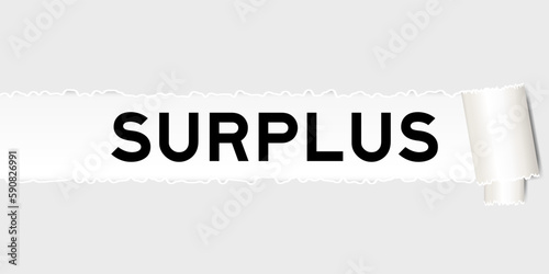 Ripped gray paper background that have word surplus under torn part