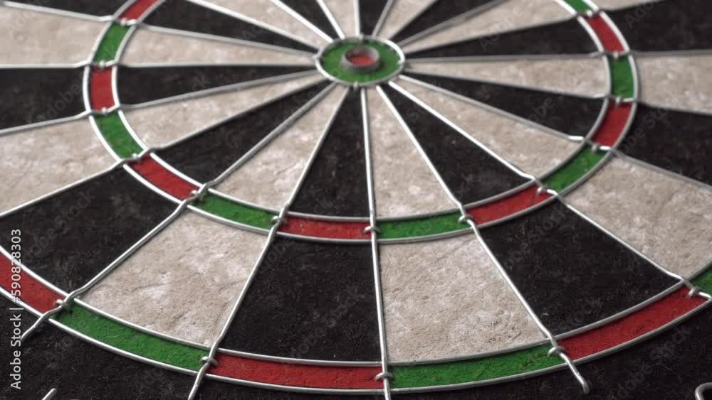 The dartboard slowly rotates. Close-up, angled view The dartboard slowly rotates. Close-up, angled view