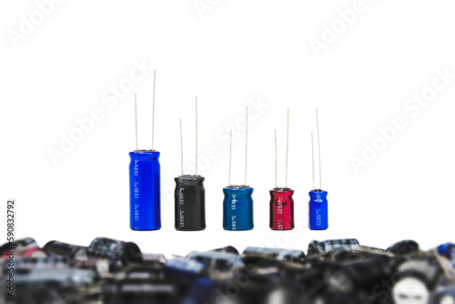 Electrolyte or electrolytic capacitors row on white background, electronic parts concept. photo