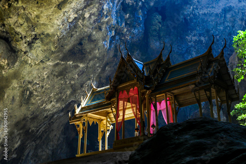Mystique view to the Phraya Nakhon Cave with the Khuha Kharuehat Pavilion illuminated by Sun through the Hole in the Rocky Top, Thailand photo
