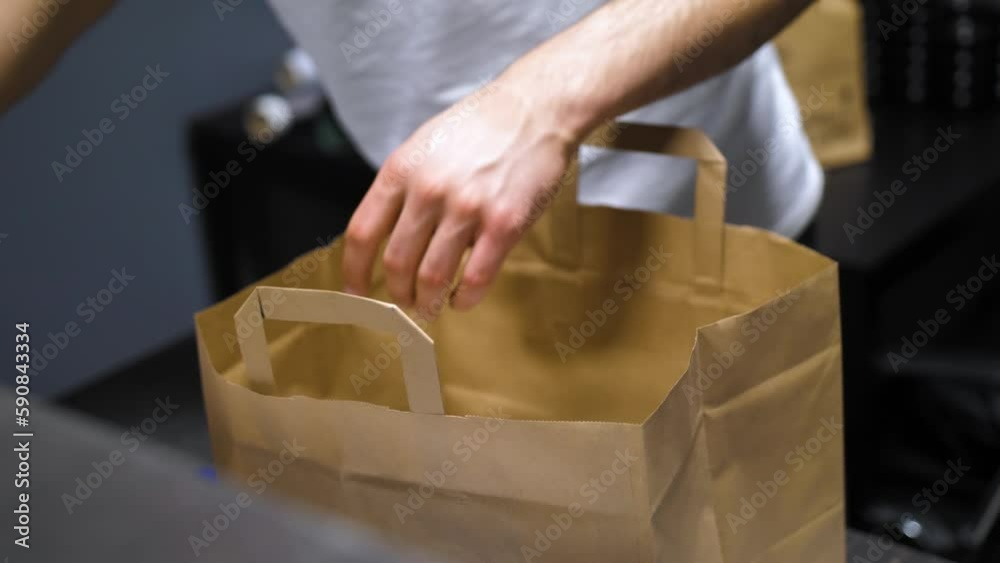 Preparing Take away food to paper back, kraft paper bag ready to ship. 4k video
