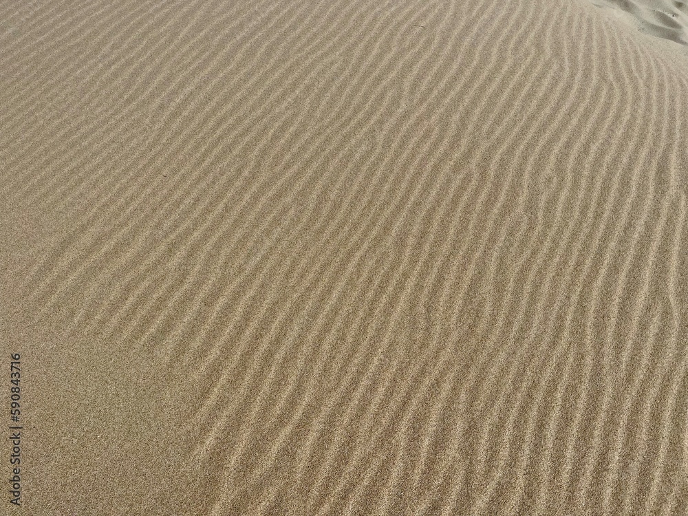 Feiner Sand in Wellenmuster geweht Feiner Sand in Wellenmuster geweht