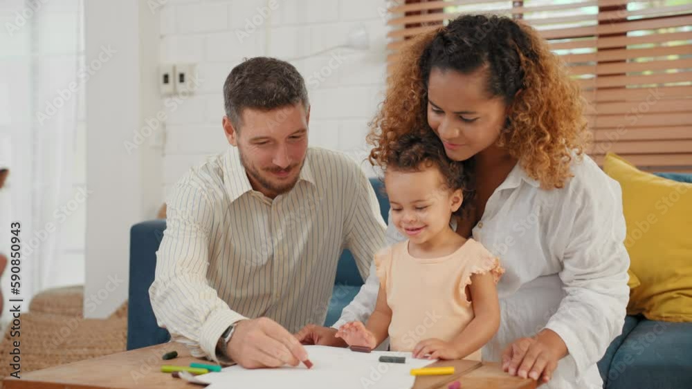 Toddler little girl are drawing and painting on paper with father and mother in living room at home Toddler little girl are drawing and painting on paper with father and mother in living room at home