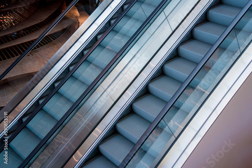 Modern automatic escalator system in shopping mall