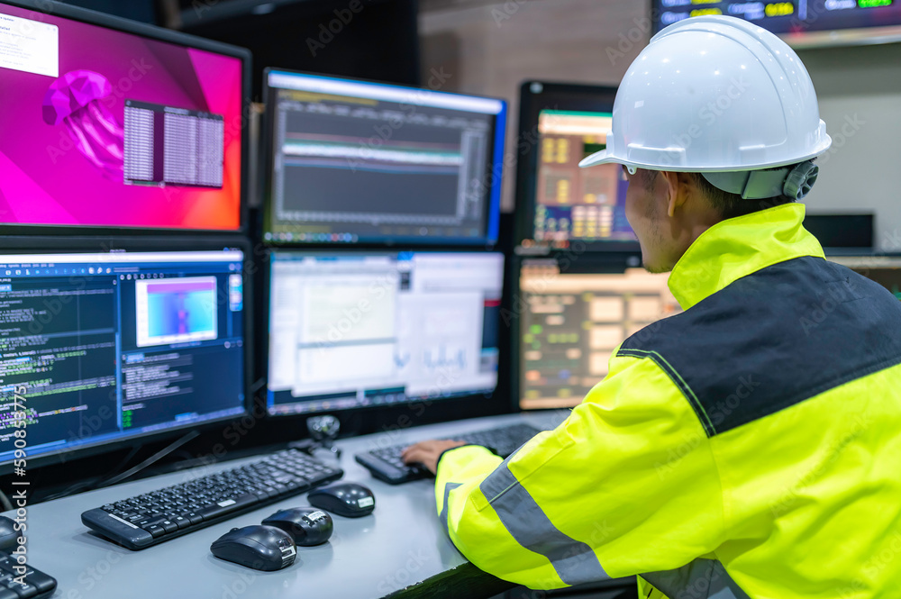 Engineer working at control room,Manager control system,Technician man monitoring program from a lot of monitor Engineer working at control room,Manager control system,Technician man monitoring program from a lot of monitor