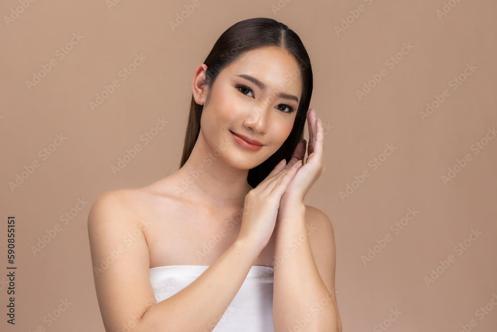 Beautiful Asian woman touching eyebrow smile with clean and fresh skin Happiness with positive emotional,isolated on Beige background,Beauty Cosmetics and spa Facial treatment Concept. Beautiful Asian woman touching eyebrow smile with clean and fresh skin Happiness with positive emotional,isolated on Beige background,Beauty Cosmetics and spa Facial treatment Concept.