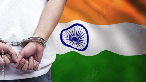 A man getting under arrest in India. Concept of being handcuffed, detained, incarcerated and jailed in said country. National law enforcement concept.