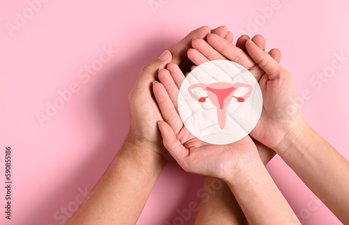 People holding virtual uterus icon reproductive system