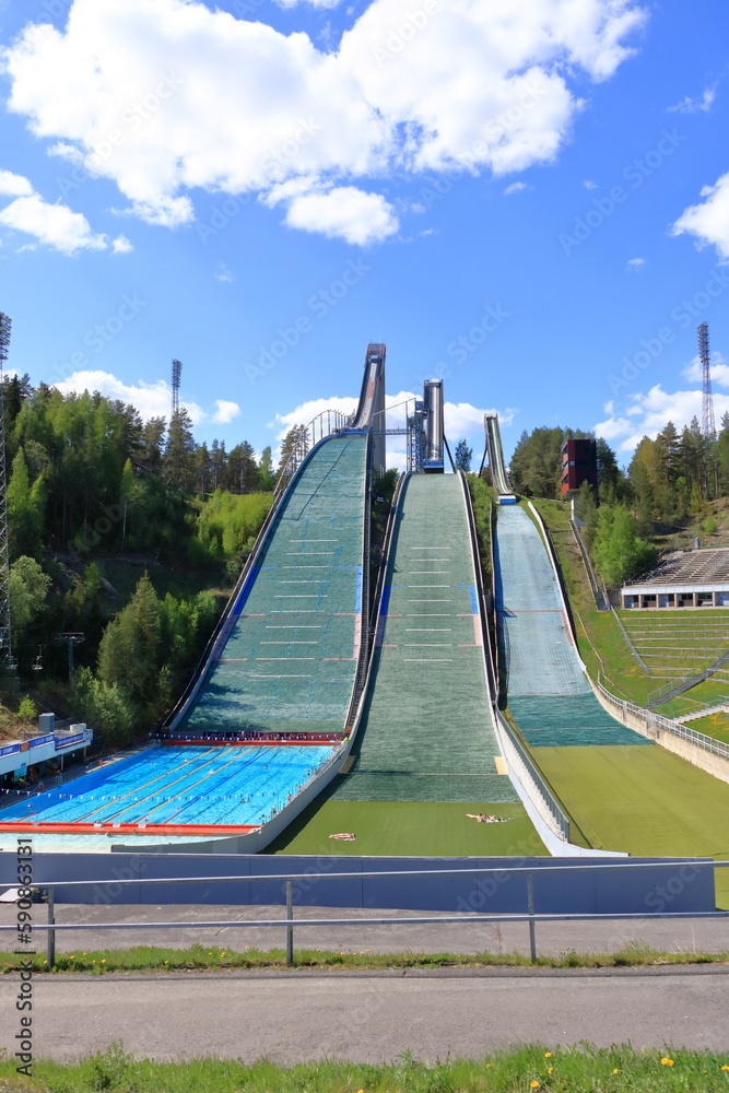 Aerial view of sports centre with three ski jump towers in the summer, Lahti, Finland