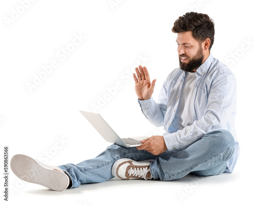 Young bearded man with lapt...