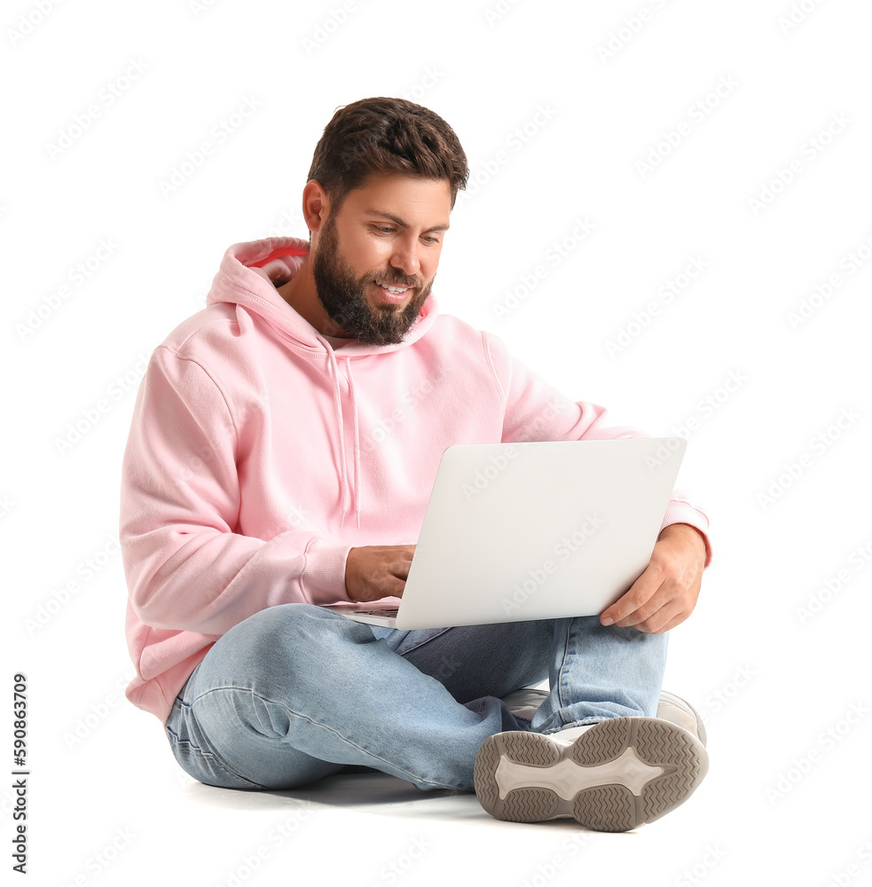 Handsome bearded man using laptop on white background Handsome bearded man using laptop on white background