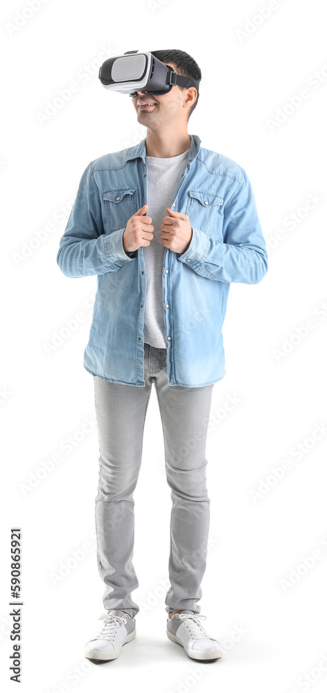 Young man using VR glasses on white background Young man using VR glasses on white background