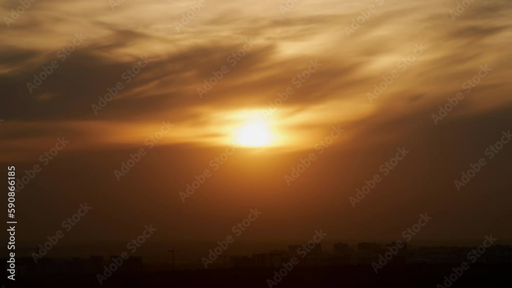 Evening clouds in the orange light of sunset rays, time lapse. Sunset sky with red light of the setting sun, timelapse Evening clouds in the orange light of sunset rays, time lapse. Sunset sky with red light of the setting sun, timelapse