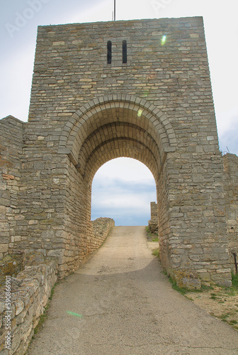 The walls of an ancient fortress on the edge of the rocks on the Black Sea coast. Medieval fortress 