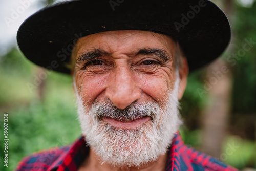 Portrait of Brazilian farmer man in the casual shirt in the farm.