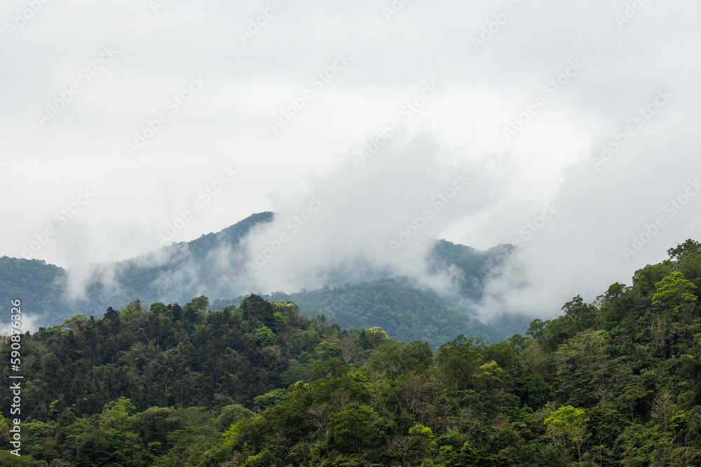Cloud over the mountain in foggy weather Cloud over the mountain in foggy weather