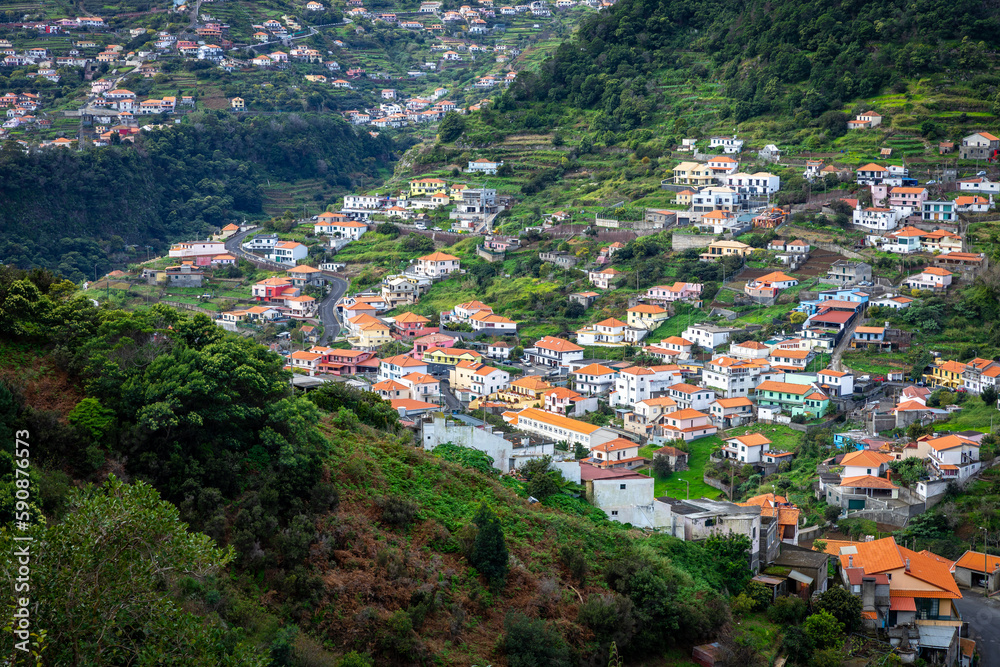 Madeira. Vereda da Boca do Risco. View of Machico village, located between green hills. Madeira Island, Portugal.