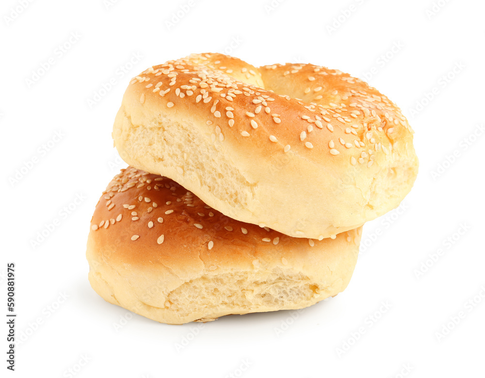 Tasty bagels with sesame seeds on white background
