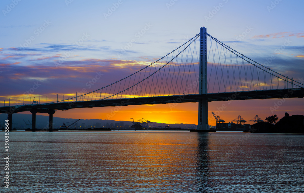 Obraz premium Eastern span of San-Francisco-Oakland Bay Bridge view at sunrise. Shot from Treasure Island, San Francisco, California, USA.