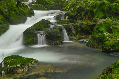 Fototapeta Naklejka Na Ścianę i Meble -  Waterfall in the mountain and rocks covered with moss