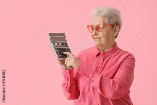 Senior woman using calculat...