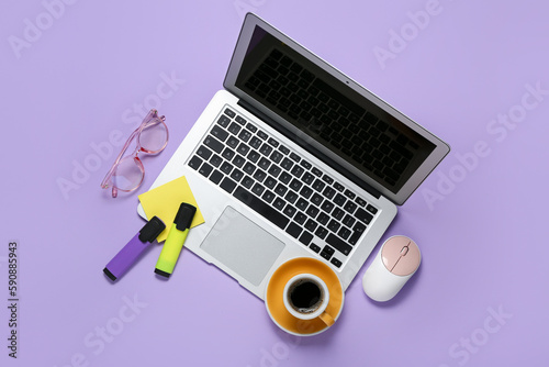 Composition with laptop, markers and coffee on lilac background