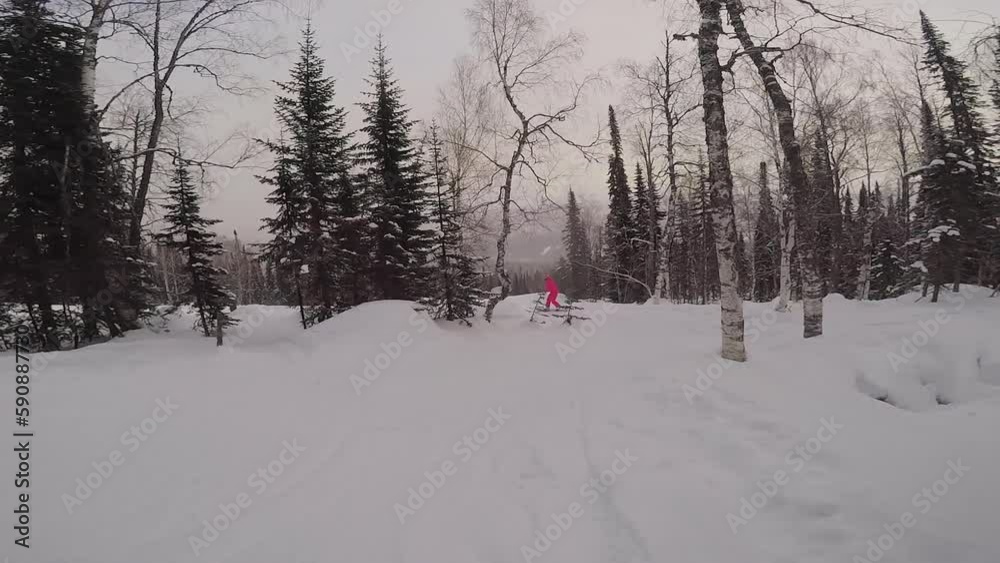 Snowboarding or skiing on a winter snowy slope. Ski resort, winter sport. Snowboarding or skiing on a winter snowy slope. Ski resort, winter sport.