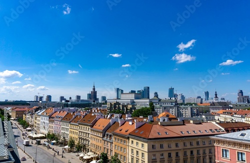 View of the Warsaw city skyline with a blue sky.