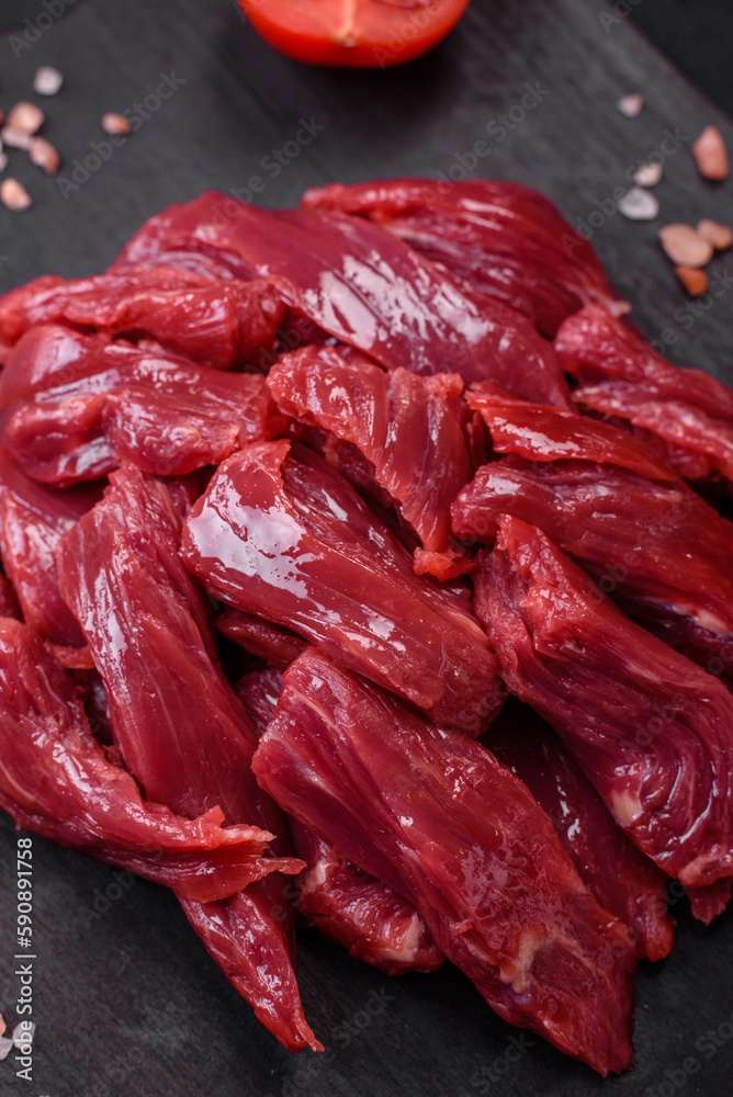Fresh raw beef with salt, spices and herbs