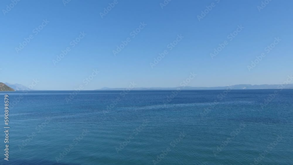 A view of the blue calm sea on a beautiful sunny day. A view of the blue calm sea on a beautiful sunny day.